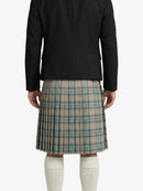 Person wearing a black jacket and plaid kilt on a white background
