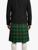 Person wearing a black jacket and green plaid kilt on a white background