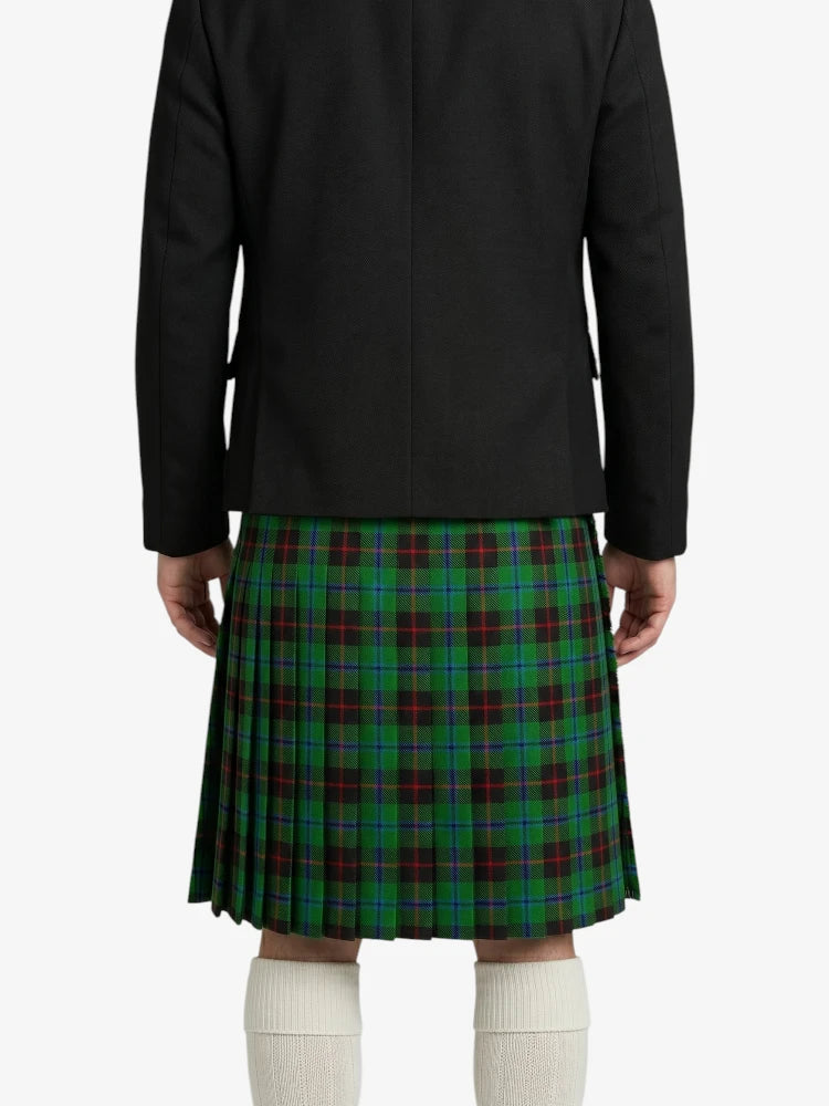 Person wearing a black jacket and green plaid kilt on a white background