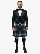 Man wearing a traditional Scottish dress gordon tartan kilt with a black prince charlie jacket and bow tie on a white background