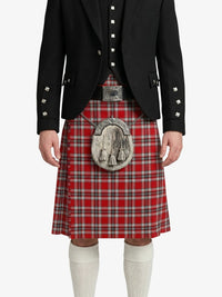 Person wearing a red tartan kilt with a black jacket on a white background