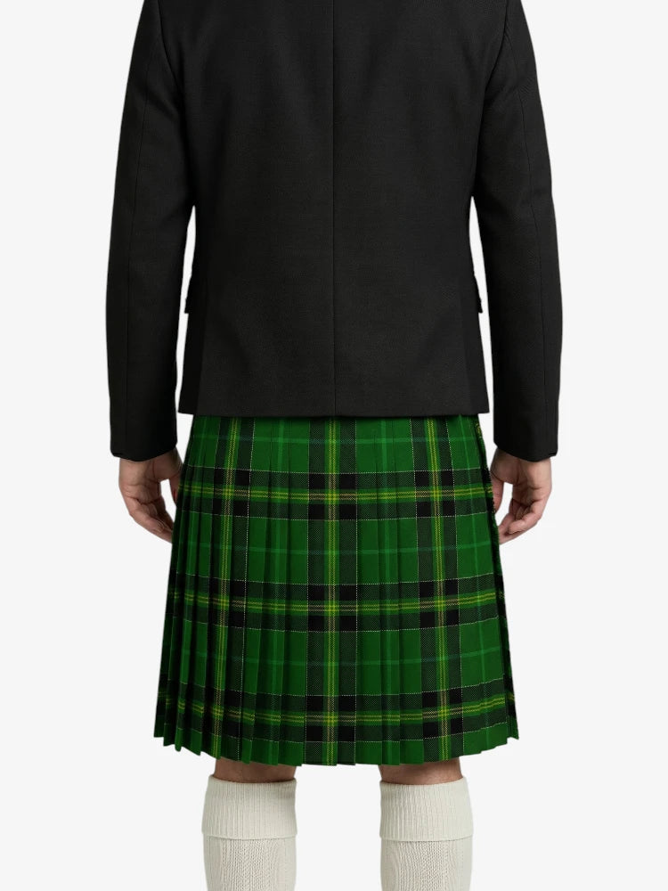 Person wearing a black jacket and green plaid kilt on a white background