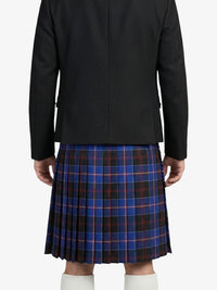Person wearing a black coat and blue plaid kilt on a white background