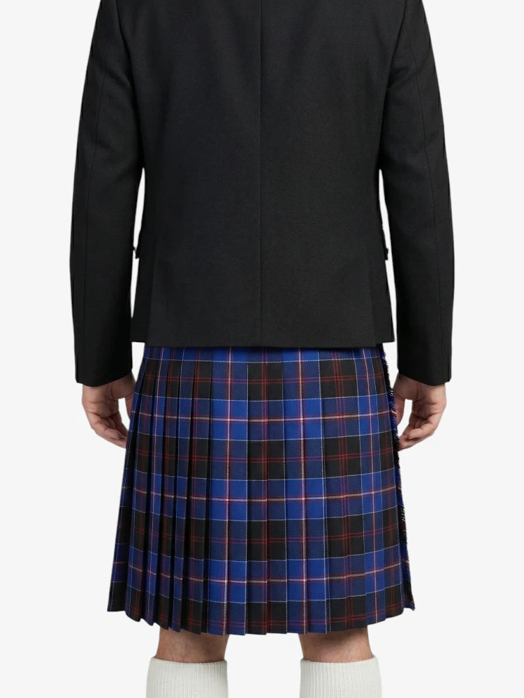 Person wearing a black coat and blue plaid kilt on a white background