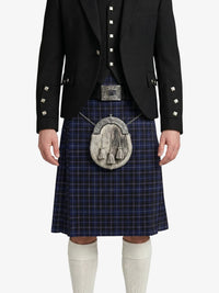 Person wearing a traditional Scottish kilt with a jacket on a white background