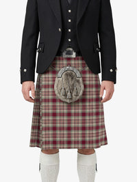 Person wearing a traditional Scottish kilt with a tartan pattern on a white background