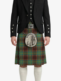 Person wearing a traditional Scottish kilt with a tartan pattern on a white background