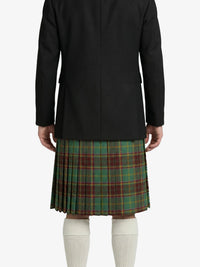 Person wearing a black coat and green plaid kilt on a white background