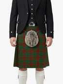 Person wearing a traditional Scottish kilt with a tartan pattern on a white background