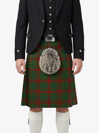 Person wearing a traditional Scottish kilt with a tartan pattern on a white background