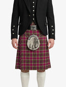 Person wearing a black jacket and red plaid kilt with a silver sporran on a white background