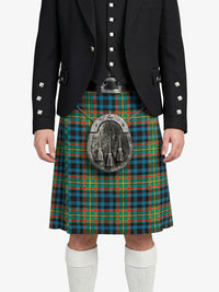 Person wearing a traditional Scottish kilt with a visible tartan pattern on a white background