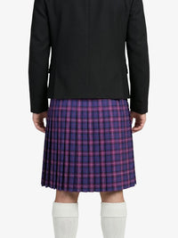 Person wearing a black jacket and plaid kilt on a white background
