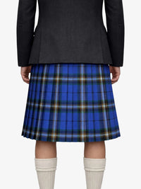 Person wearing a black jacket and blue plaid kilt on a white background