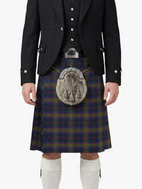Person wearing a traditional Scottish kilt with a tartan pattern on a white background