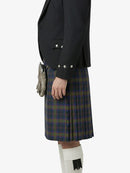 Person wearing a dark jacket and plaid kilt on a white background