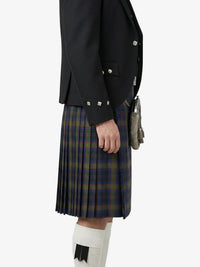 Person wearing a black jacket and plaid kilt on a white background