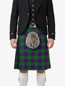 Person wearing a traditional Scottish kilt with a plaid pattern on a white background