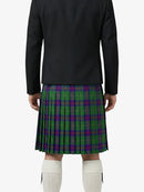 Person wearing a black jacket and green plaid kilt on a white background