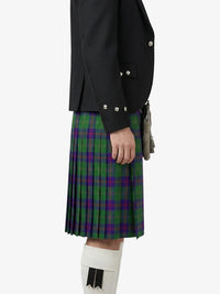 Person wearing a green plaid kilt with a black jacket on a white background