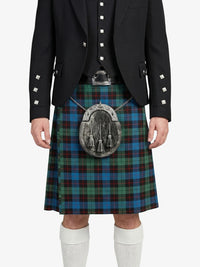 Person wearing a black jacket and tartan kilt with a silver sporran on a white background