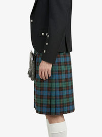 Person wearing a black jacket and plaid kilt on a white background