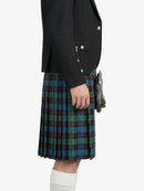 Person wearing a black jacket and plaid kilt on a white background