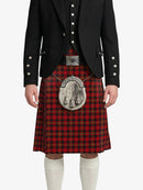 Person wearing a red tartan kilt with a black jacket on a white background
