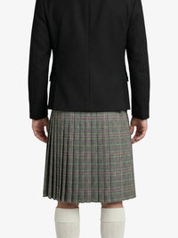 Person wearing a black jacket and plaid kilt on a white background