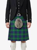 Person wearing a traditional Scottish kilt with a tartan pattern on a white background