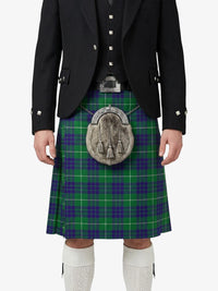 Person wearing a traditional Scottish kilt with a tartan pattern on a white background
