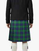 Person wearing a black jacket and green plaid kilt on a white background