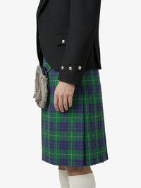 Person wearing a green and purple plaid kilt with a black jacket on a white background