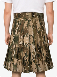 Camouflage skirt worn by a person on a white background