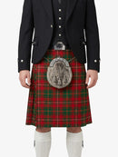 Person wearing a traditional Scottish kilt with a tartan pattern on a white background