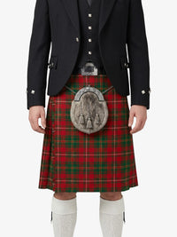 Person wearing a traditional Scottish kilt with a tartan pattern on a white background