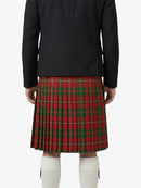 Person wearing a black jacket and red plaid skirt on a white background