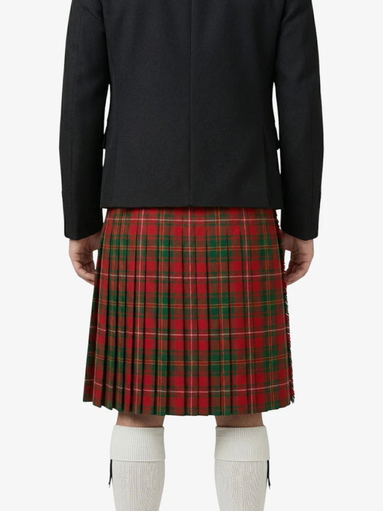 Person wearing a black jacket and red plaid skirt on a white background