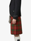 Person wearing a black blazer and red plaid kilt on a white background
