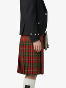 Person wearing a black jacket and red plaid kilt on a white background