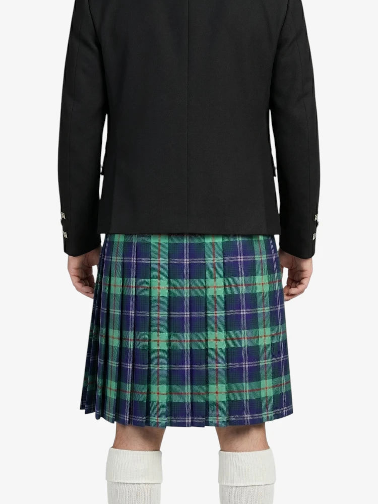 Person wearing a black jacket and green plaid kilt on a white background