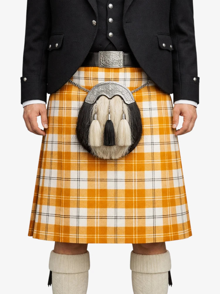 Person wearing a traditional Scottish kilt with a plaid pattern on a white background
