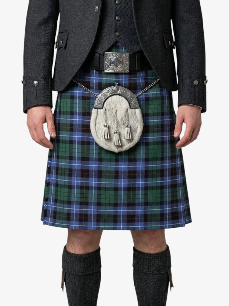 Person wearing a traditional Scottish kilt with a tartan pattern on a white background