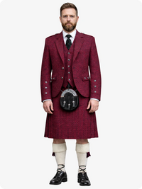 Man wearing a traditional maroon Scottish kilt outfit on a white background
