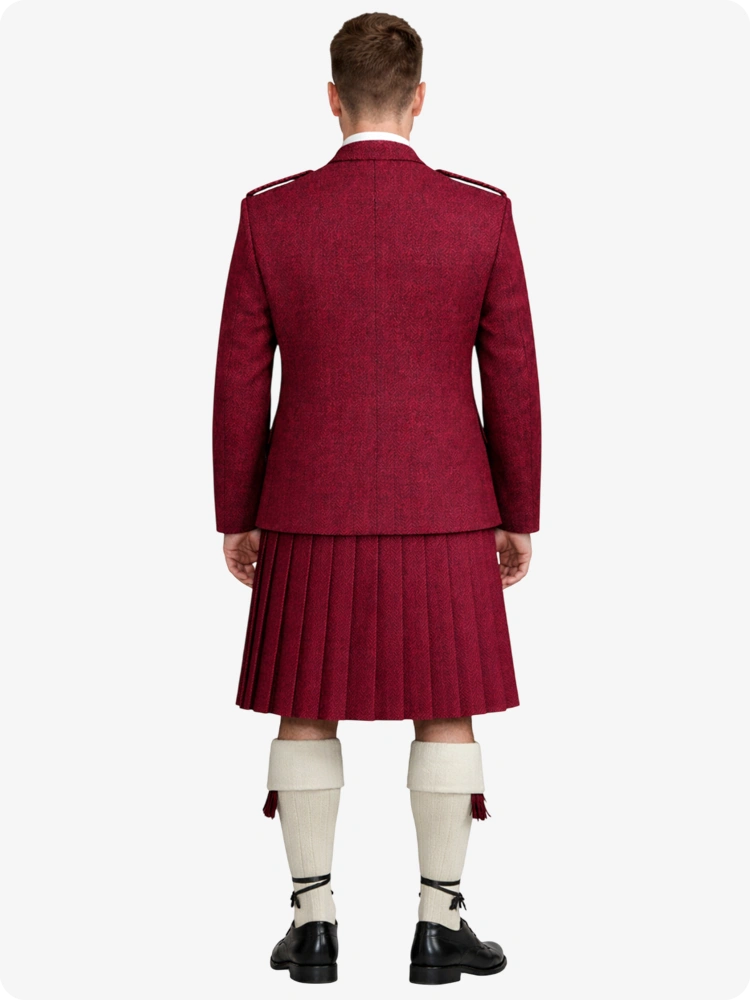 Person wearing a maroon blazer and pleated skirt with white socks and shoes on a white background