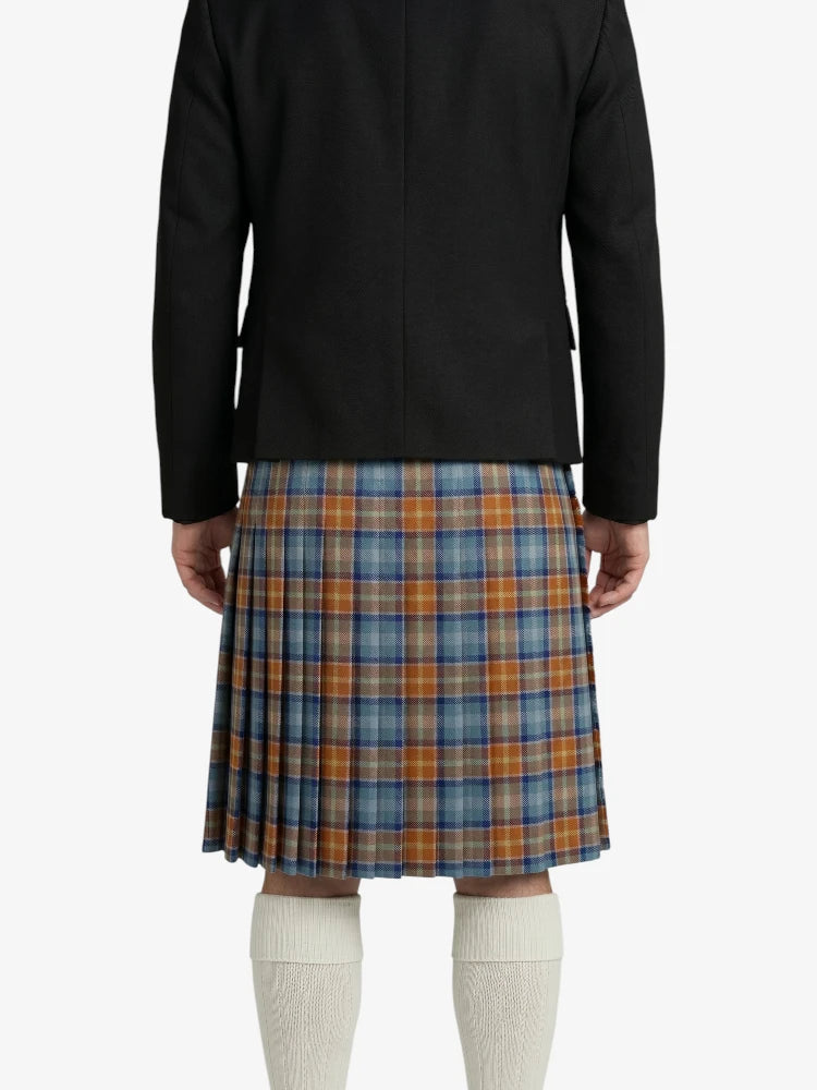 Person wearing a black jacket and plaid kilt on a white background