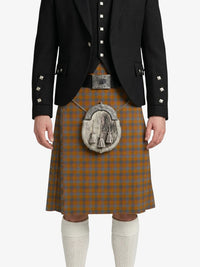 Person wearing a traditional Scottish kilt with a jacket on a white background