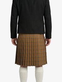 Person wearing a black jacket and plaid kilt on a white background
