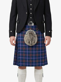 Person wearing a traditional Scottish kilt with a jacket on a white background