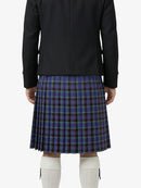 Person wearing a black jacket and blue plaid kilt on a white background